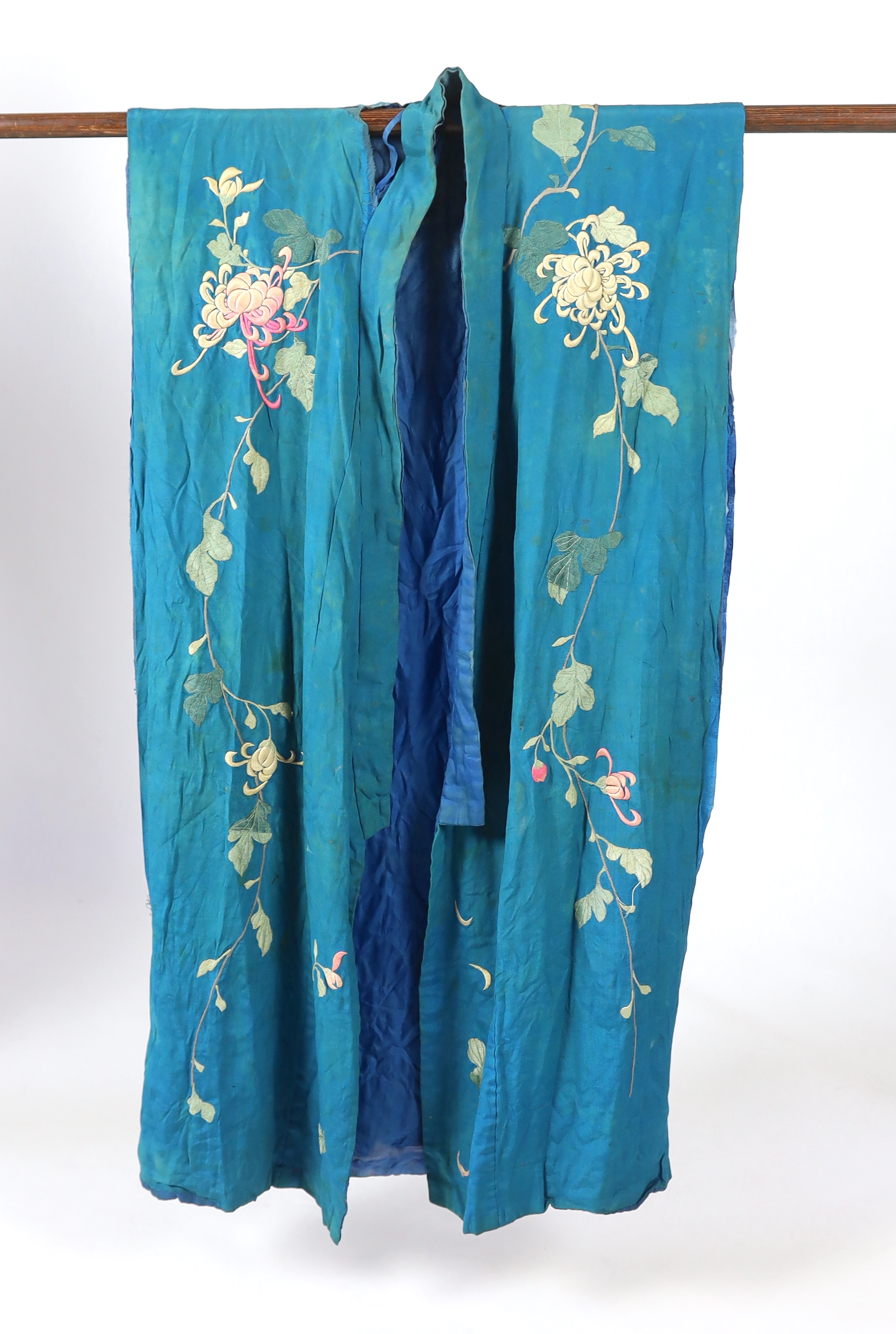 An early 20th century silk crêpe Japanese kimono and fringed tie belt, the back panel heavily embroidered with trailing chrysanthemum type flowers and leaves. This item is being sold for the back panel only and is with a